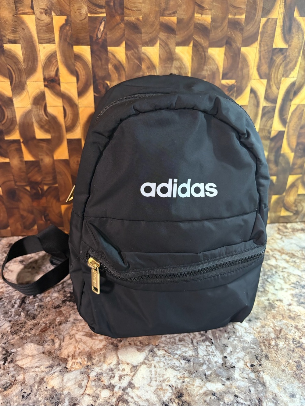 adidas Black Mini Backpack with Gold Zipper Accents